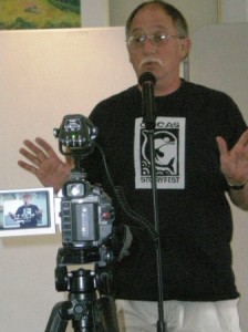 Doug Banner, live and on camera, telling a story to Orcas Islanders. Banner will be the featured presenter at a workshop Friday, Aug. 7, on turning mementos into stories.