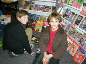 Daniel  O'Brien and Owen Thurman, Orcas Elementary Fifth-Graders, look up from the books they're engrossed in at the PTSA Book Fair.