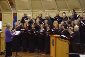 Director Catherine Pederson conducts the Orcas Choral Society at this spring's school benefit concert.