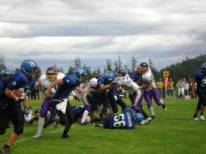 Bredouw evades Wolverine tackles for a first down.