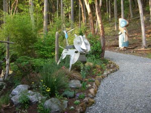 Whimsical sculptures inhabit the Kaplan garden, featured on the "Orcas in Bloom" garden tour
