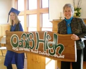 Lily Huffstodt and Marta Branch hold sign that Lily made for her Senior Project