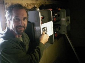 Utter installs the transformer panel in the basement of the home