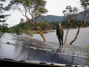 Jeffrey Utter, installing solar panels on roof of Eastsound home last week