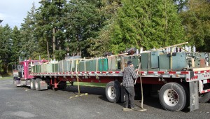 OPALCO loads old transformers for recycling