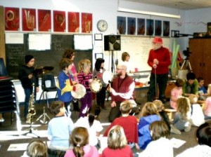 Willie Thomas (in trademark red hat) and Al Bentley introduce Orcas Elementary Students to the Jazz Experience.