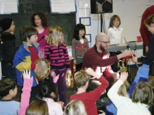 Orcas Elementary Students dance and play with Al Bentley, who with Emily Miner will assist Willie Thomas as he teaches "The Jazz Experience." Students are from left, Micahel Mullan, Kayla Champman, Hazel Moe, Alana Lago and Destiny Wright 